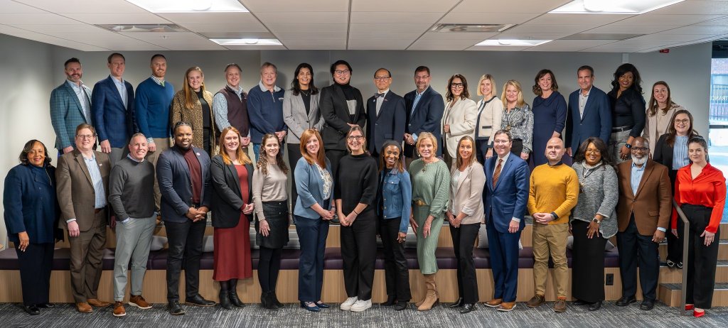 A group of people smiling for a photo